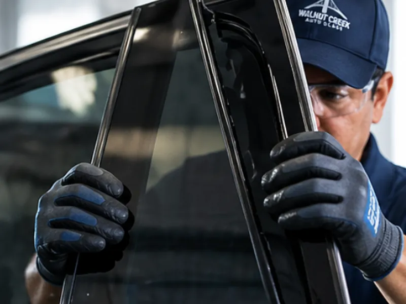Auto Glass of Bellevue technician installing door glass